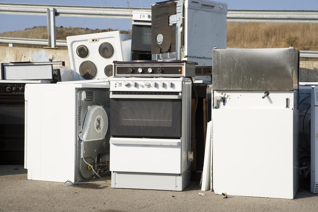 appliances junk on dumpster